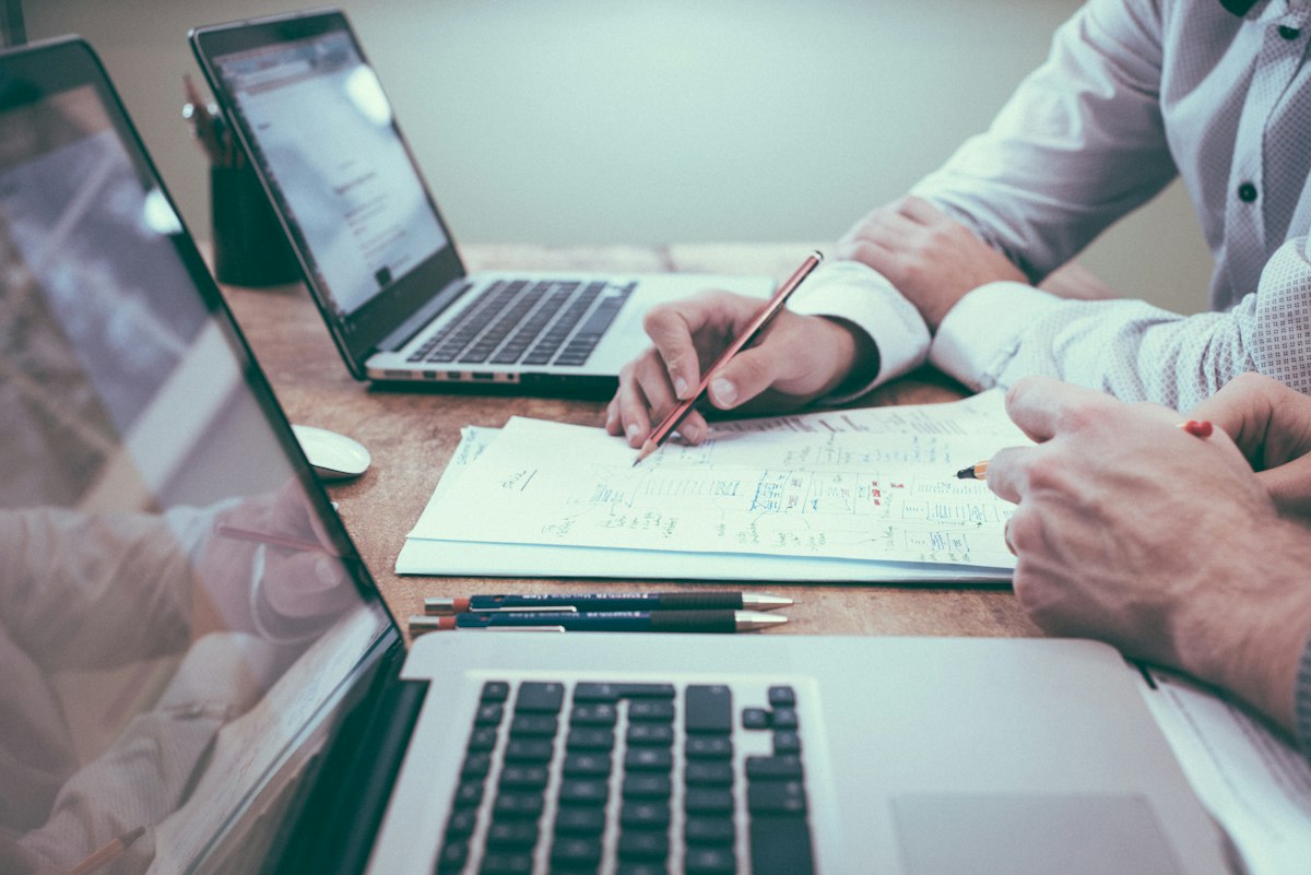 Finance professionals reviewing reports together